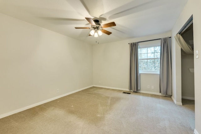7409 Shadow Hill Dr Unit 105, Austin, TX 78731 - unfurnished bedroom with carpet floors, baseboards, and ceiling fan