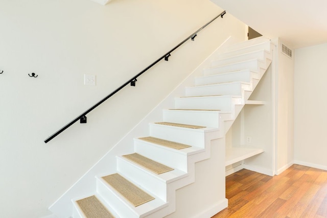 7409 Shadow Hill Dr Unit 105, Austin, TX 78731 - stairs featuring wood finished floors and baseboards