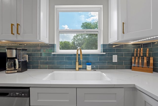 12635 Live Oak Ln, Buda, TX 78610 - kitchen featuring a sink, dishwasher, white cabinets, and tasteful backsplash