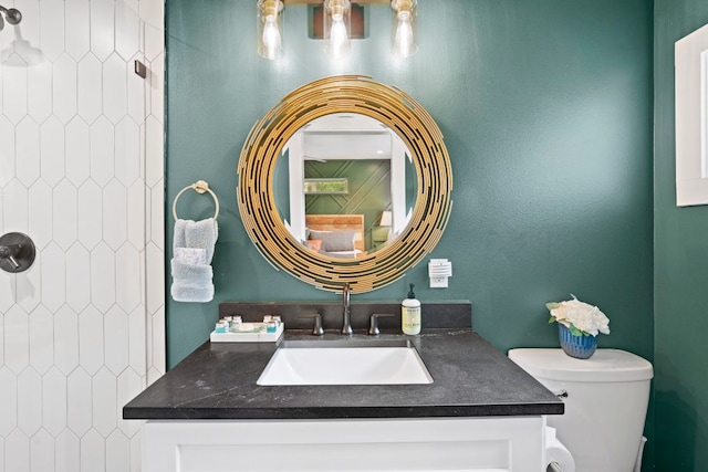 12635 Live Oak Ln, Buda, TX 78610 - full bathroom featuring toilet, vanity, and a tile shower