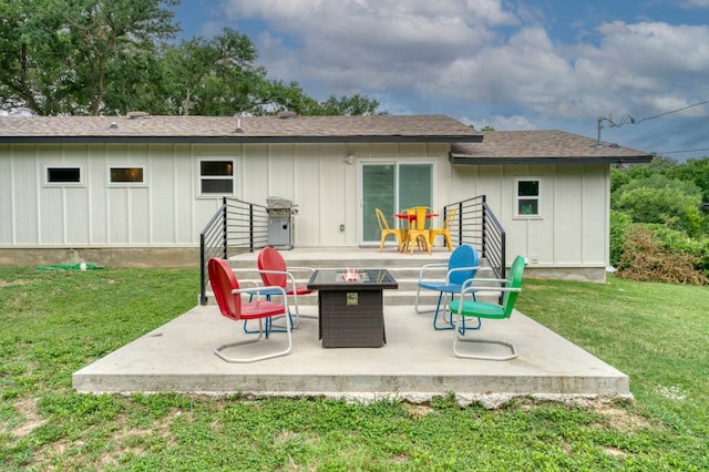 12635 Live Oak Ln, Buda, TX 78610 - back of property with an outdoor fire pit, a patio area, a lawn, and board and batten siding
