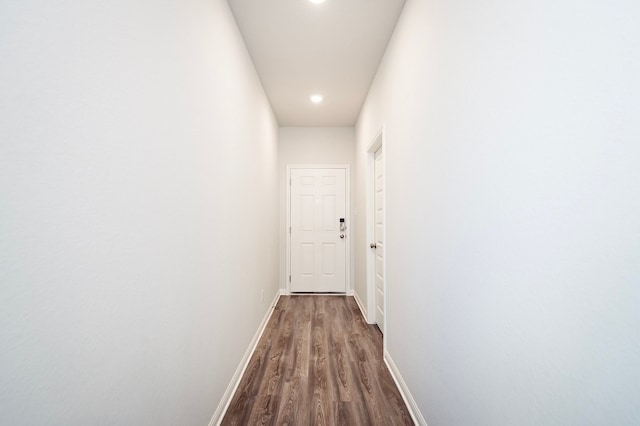 205 Escape Way, Jarrell, TX 76537 - hallway featuring dark wood-type flooring, baseboards, and recessed lighting