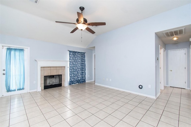 7201 Pappus Ct, Temple, TX 76502 - unfurnished living room with a ceiling fan, light tile patterned floors, vaulted ceiling, and a tiled fireplace