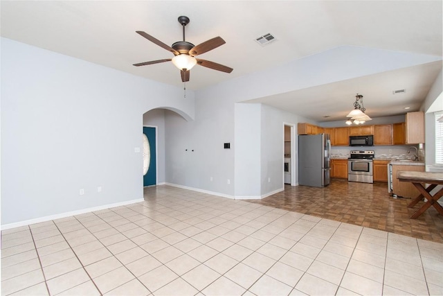 7201 Pappus Ct, Temple, TX 76502 - unfurnished living room featuring arched walkways and a ceiling fan