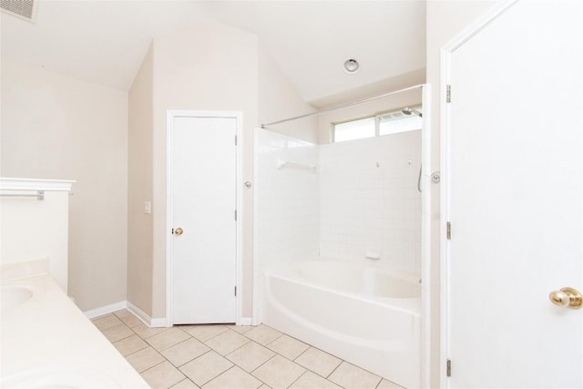 7201 Pappus Ct, Temple, TX 76502 - bathroom featuring  shower combination, tile patterned flooring, lofted ceiling, and double vanity