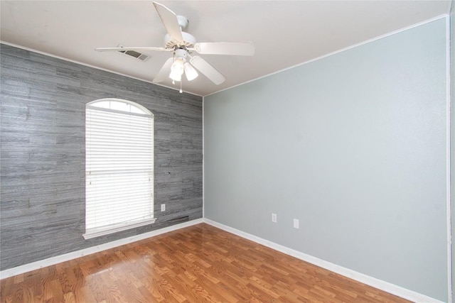 7201 Pappus Ct, Temple, TX 76502 - spare room with a ceiling fan, ornamental molding, and wood finished floors