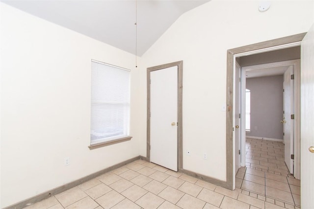 7201 Pappus Ct, Temple, TX 76502 - unfurnished room with lofted ceiling, light tile patterned flooring, and a smoke detector