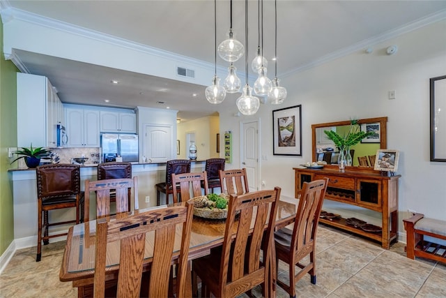 1001 The Cape Rd Unit 32, Horseshoe Bay, TX 78657 - dining area with ornamental molding and light tile patterned floors