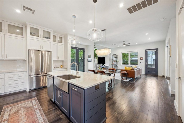 1303 Harriet Ct Unit A, Austin, TX 78756 - kitchen featuring appliances with stainless steel finishes, white cabinets, healthy amount of natural light, and recessed lighting