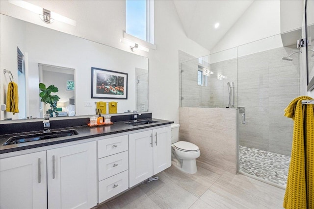 1303 Harriet Ct Unit A, Austin, TX 78756 - full bath with a shower stall, double vanity, and vaulted ceiling