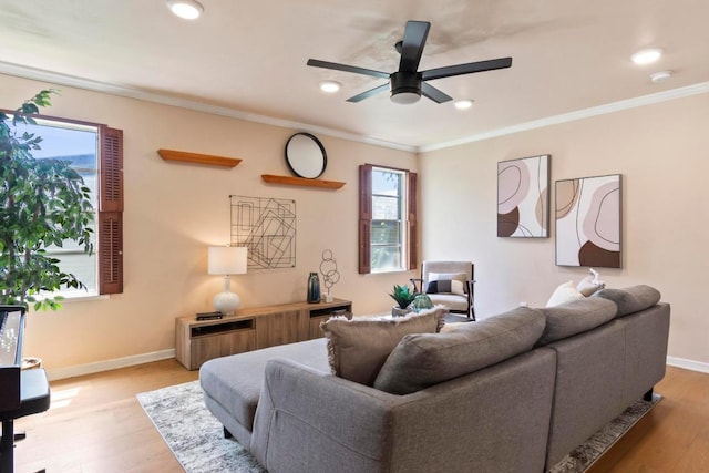 1201 Larkwood Dr, Austin, TX 78723 - living area featuring a ceiling fan, baseboards, light wood-style floors, ornamental molding, and recessed lighting