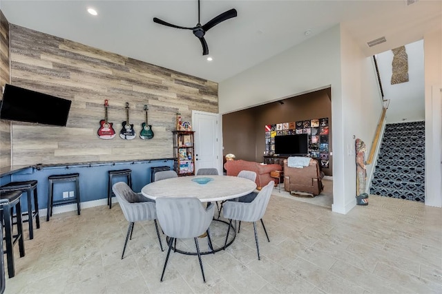 8612 Tip Top Dr Unit 2, Jonestown, TX 78645 - dining area with wood walls, an accent wall, recessed lighting, ceiling fan, and stairway