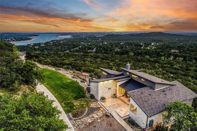 8612 Tip Top Dr Unit 2, Jonestown, TX 78645 - aerial view at dusk of a water view and a view of trees