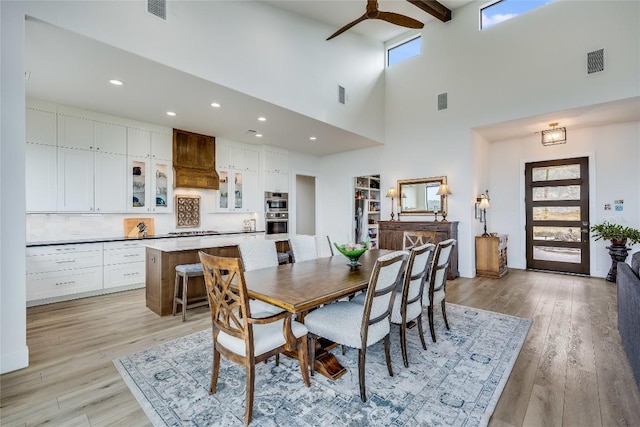 8612 Tip Top Dr Unit 2, Jonestown, TX 78645 - dining room with a ceiling fan, light wood-style flooring, recessed lighting, and a high ceiling