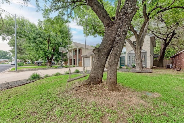12203 Arrowwood Dr, Austin, TX 78727 - view of front facade with a front lawn and concrete driveway