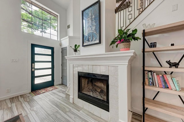 12203 Arrowwood Dr, Austin, TX 78727 - foyer entrance with a tile fireplace and baseboards