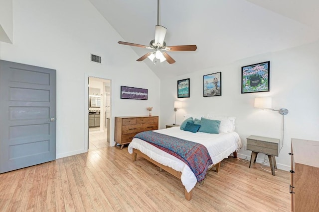 12203 Arrowwood Dr, Austin, TX 78727 - bedroom with light wood-style floors, high vaulted ceiling, baseboards, ceiling fan, and ensuite bathroom