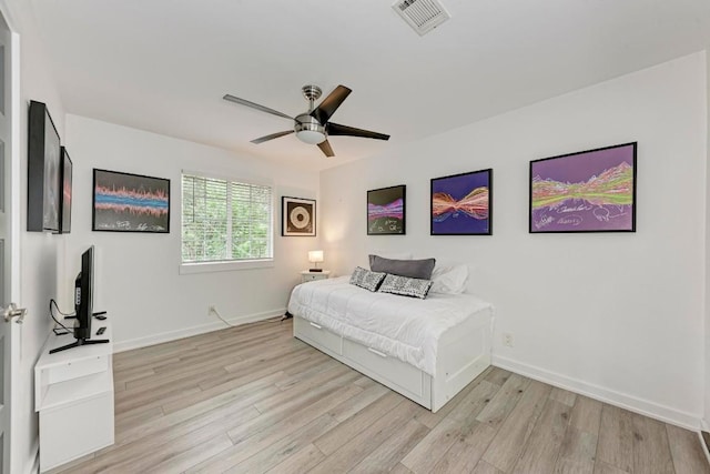 12203 Arrowwood Dr, Austin, TX 78727 - bedroom with light wood-style floors and a ceiling fan