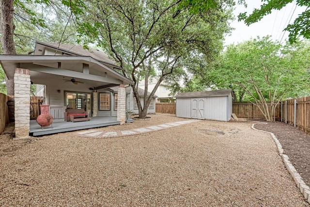 12203 Arrowwood Dr, Austin, TX 78727 - fenced backyard with ceiling fan and a storage unit