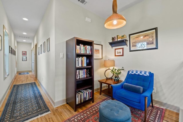 1907 E 20th St, Austin, TX 78722 - sitting room featuring wood finished floors and recessed lighting