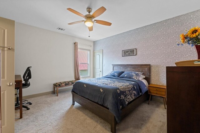 1907 E 20th St, Austin, TX 78722 - carpeted bedroom with a ceiling fan and baseboards