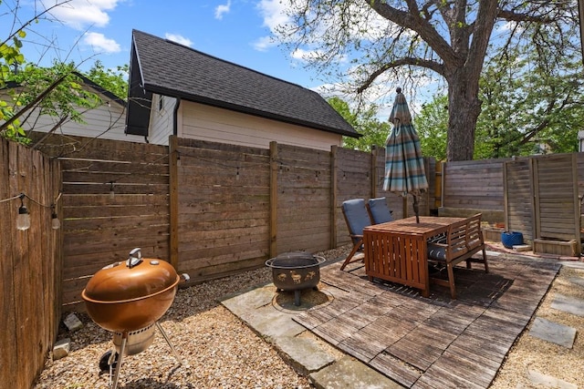 1907 E 20th St, Austin, TX 78722 - fenced backyard with a fire pit, outdoor dining space, and area for grilling