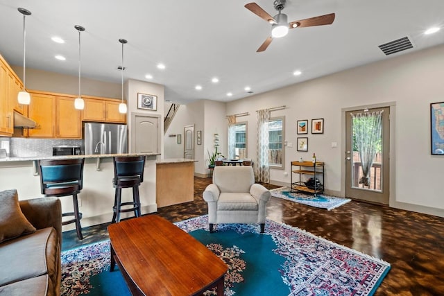 1907 E 20th St, Austin, TX 78722 - living area with recessed lighting, ceiling fan, and finished concrete flooring
