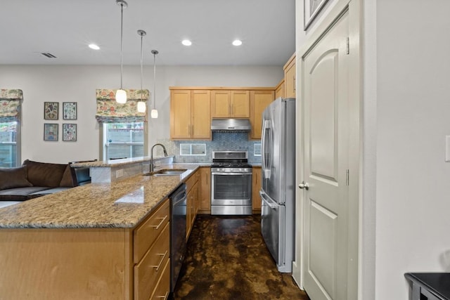 1907 E 20th St, Austin, TX 78722 - kitchen featuring stainless steel appliances, under cabinet range hood, a peninsula, concrete floors, and light stone countertops
