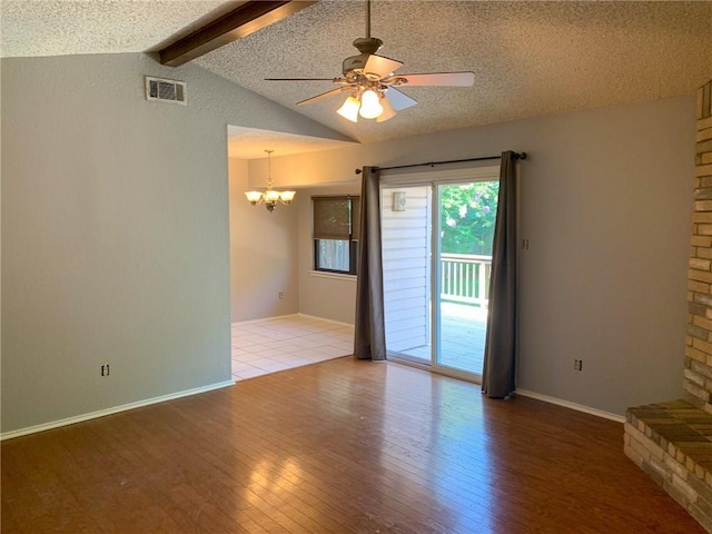 2304 Lasso Dr, Round Rock, TX 78681 - unfurnished room featuring wood-type flooring, a chandelier, a textured ceiling, and ceiling fan