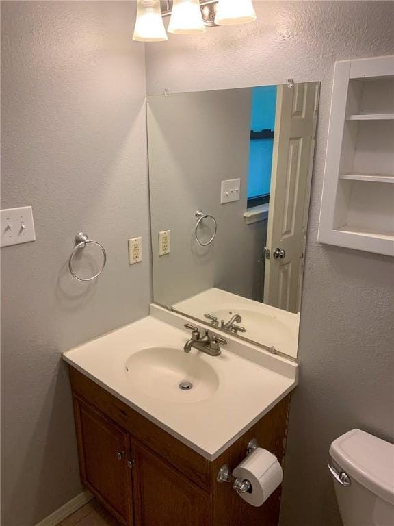 2304 Lasso Dr, Round Rock, TX 78681 - half bath featuring vanity and a textured wall