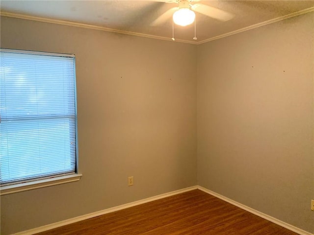 2304 Lasso Dr, Round Rock, TX 78681 - unfurnished room featuring dark wood-style flooring, a ceiling fan, and crown molding