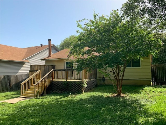 2304 Lasso Dr, Round Rock, TX 78681 - rear view of property with a fenced backyard and a deck