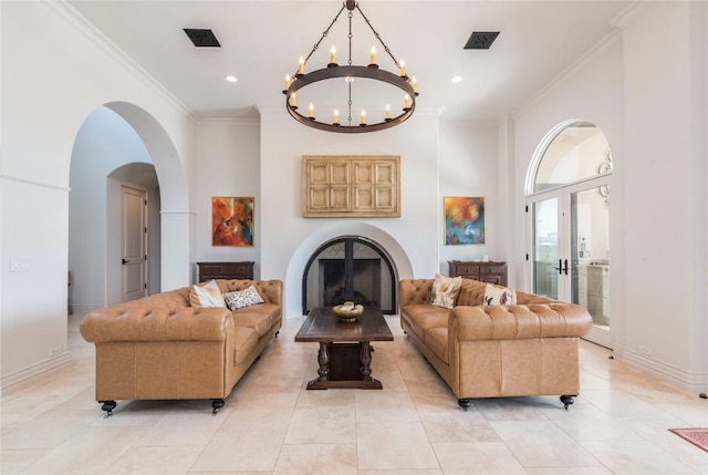 1300 Apache Tears, Horseshoe Bay, TX 78657 - living area featuring ornamental molding, a fireplace, a chandelier, arched walkways, and recessed lighting