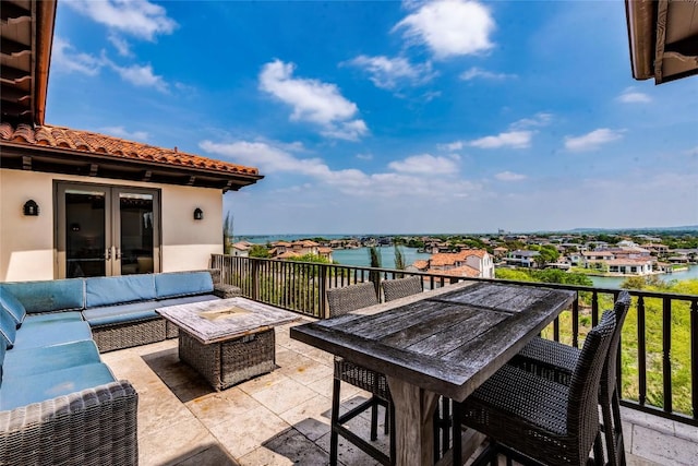 1300 Apache Tears, Horseshoe Bay, TX 78657 - view of patio / terrace featuring french doors, a water view, an outdoor hangout area, and outdoor dining area