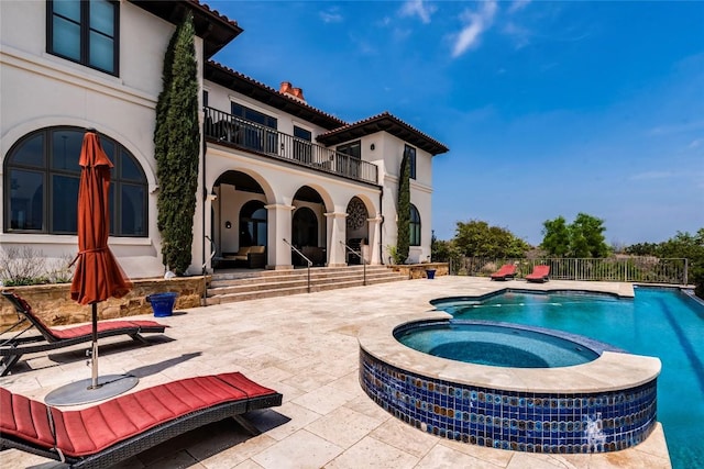 1300 Apache Tears, Horseshoe Bay, TX 78657 - view of swimming pool featuring a patio and a pool with connected hot tub