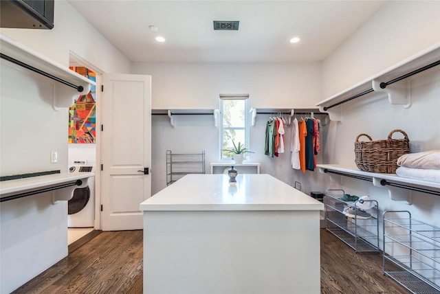 1300 Apache Tears, Horseshoe Bay, TX 78657 - walk in closet with washer / dryer and dark wood-type flooring