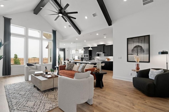 20502 Ed Townes Ter, Manor, TX 78653 - living area with beam ceiling, a ceiling fan, light wood-style floors, recessed lighting, and high vaulted ceiling