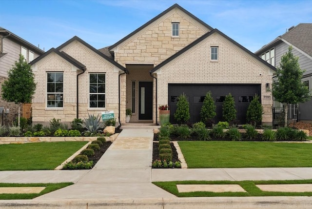 20502 Ed Townes Ter, Manor, TX 78653 - french provincial home featuring a front lawn, stone siding, and a garage