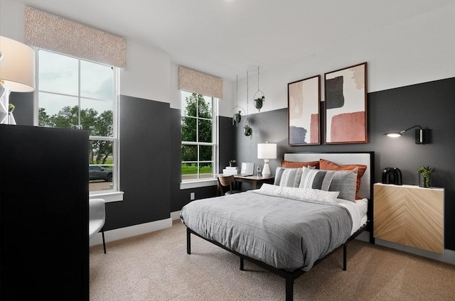 13611 Thomas Wheeler Way, Manor, TX 78653 - bedroom featuring light carpet and baseboards
