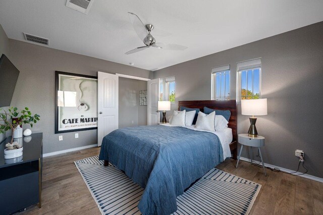 17500 Bridgefarmer Blvd, Pflugerville, TX 78660 - bedroom with wood finished floors and a ceiling fan