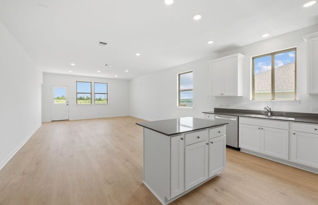 918 Childress Dr, Temple, TX 76501 - kitchen with dishwasher, dark countertops, light wood-style floors, and recessed lighting