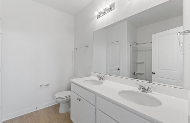 918 Childress Dr, Temple, TX 76501 - full bath with double vanity, wood finished floors, and a shower