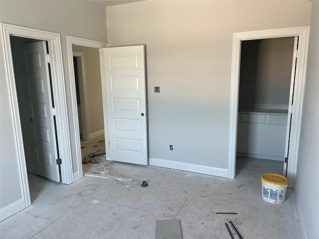 unfurnished bedroom featuring baseboards