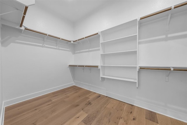5513 Olimpico Way, Leander, TX 78641 - walk in closet with wood finished floors