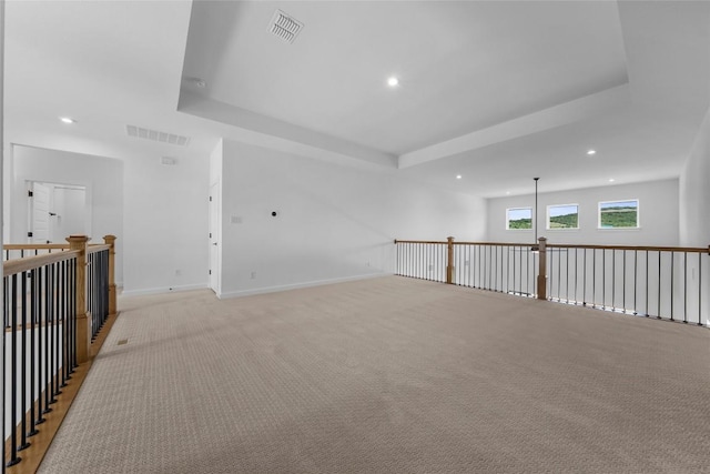 5513 Olimpico Way, Leander, TX 78641 - unfurnished room with recessed lighting, a raised ceiling, and light colored carpet