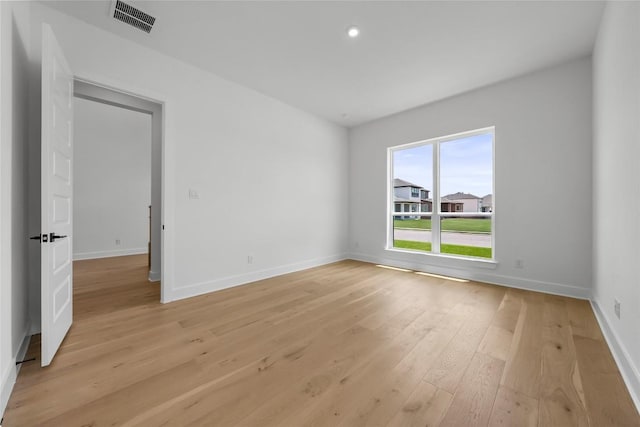 5513 Olimpico Way, Leander, TX 78641 - empty room with light wood-style floors and recessed lighting
