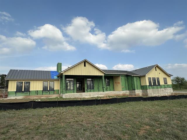 400 Shale, Horseshoe Bay, TX 78657 - back of house featuring a yard and metal roof