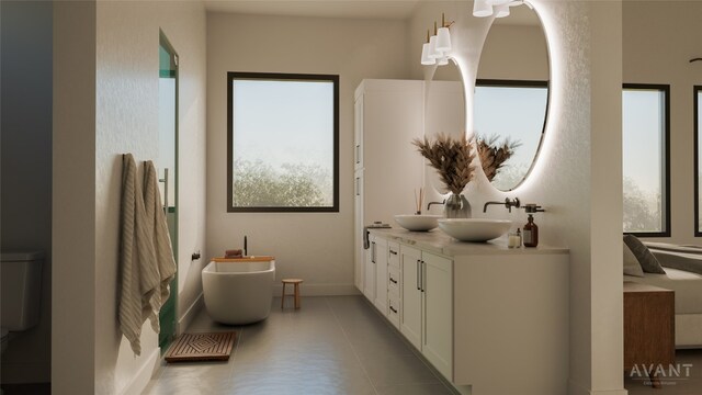400 Shale, Horseshoe Bay, TX 78657 - bathroom with double vanity, a freestanding bath, toilet, and baseboards