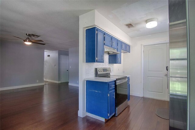 311 August St, Schulenburg, TX 78956 - kitchen featuring light countertops, blue cabinetry, under cabinet range hood, visible vents, and appliances with stainless steel finishes