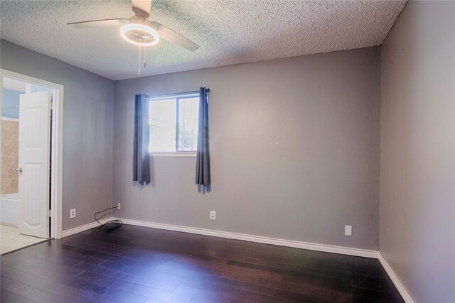 311 August St, Schulenburg, TX 78956 - unfurnished room with wood-type flooring, baseboards, and a ceiling fan